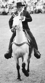 Allen Uku Lindsey riding as a Spanish cowboy.